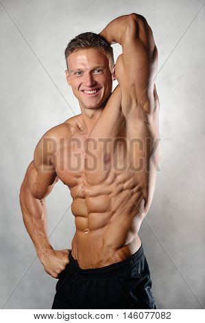 Strong Athletic Man Fitness Model Showing Six Pack Abs