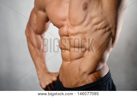 Strong Athletic Man Fitness Model Showing Six Pack Abs
