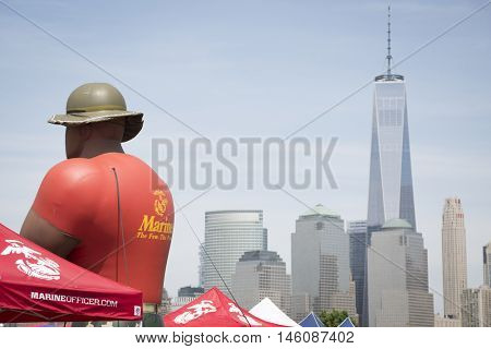 JERSEY CITY NJ MAY 29 2016: Giant inflated balloon of a US Marine Corpsman at Liberty State Park with the Freedom Tower and New York City skyline in the background seen during Fleet Week 2016.