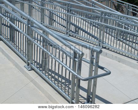 Switchback ramp to sky bridge crossing major traffic artery.