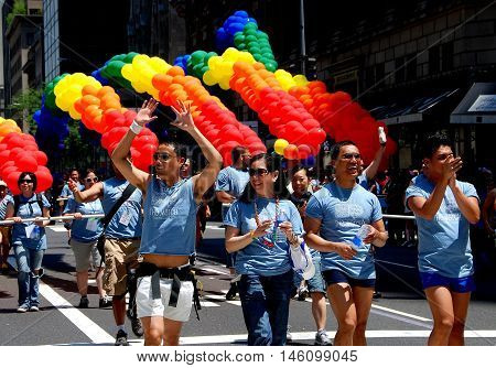 New York City - June 30 2007: Staff marchers with the rainbow flag balloon arches at the 2007 Gay Prtide Parade on Fifth Avenue