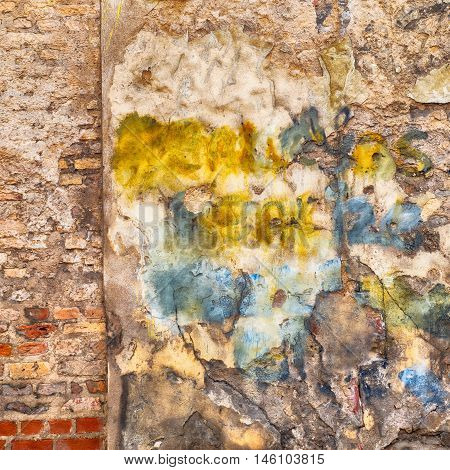 colorful painted abandoned stucco brick wall background