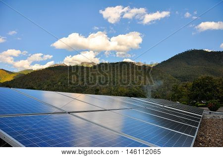 Northern Thailand, December 23, 2010: Solar PV with mountain in the background, Northern Thailand.