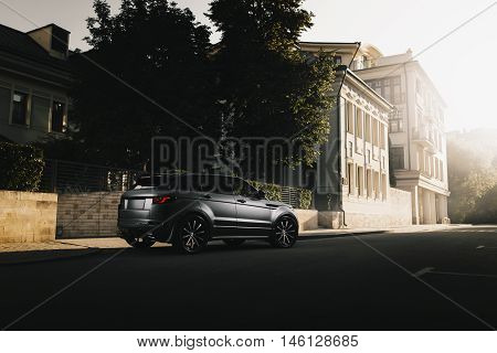 Moscow, Russia - August 06, 2016: Car Land Rover Range Rover Evoque standing on asphalt road in city Moscow at sunset
