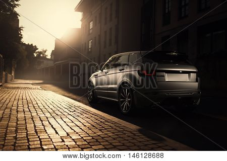 Moscow, Russia - August 06, 2016: Car Land Rover Range Rover Evoque standing on asphalt road in city Moscow at sunset