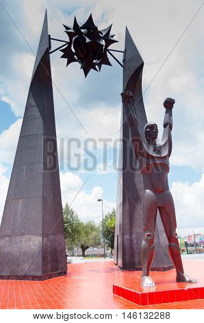 Quito, Ecuador - 28 APRIL, 2015 Historic monument of man standing in roudabout in the valley of Los Chillos