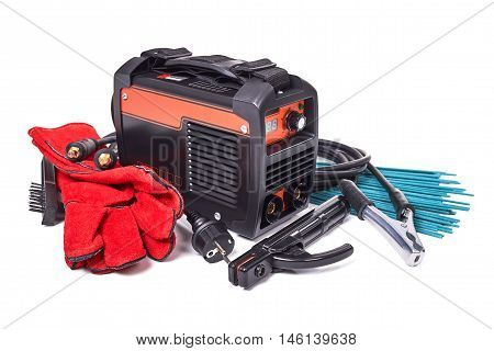 Inverter welding machine, welding equipment, isolated on a white background, leather gloves, welding electrodes, high-voltage wires with clips, set of accessories for arc welding