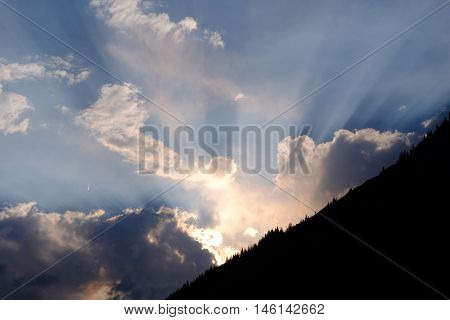 Sunbeams through clouds on sunset. Banff Natioanal Park. Alberta. Canada.
