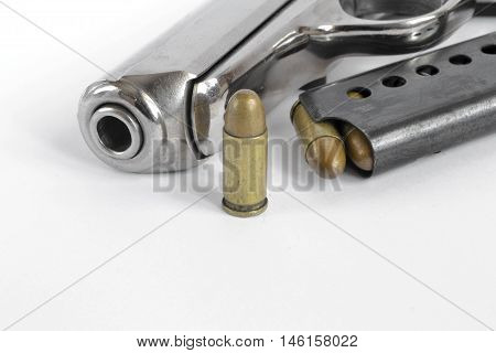 Pistol and ammunition on the white background.