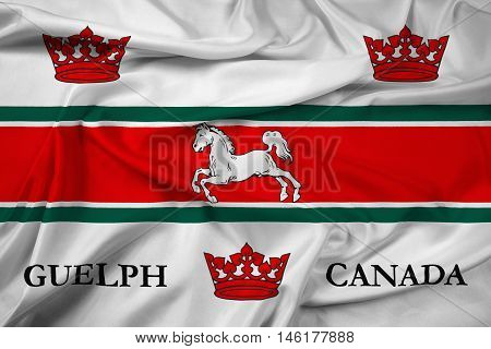 Waving Flag of Guelph Canada, with beautiful satin background. 3D illustration