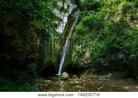 Waterfall in a forest of Molina Italy