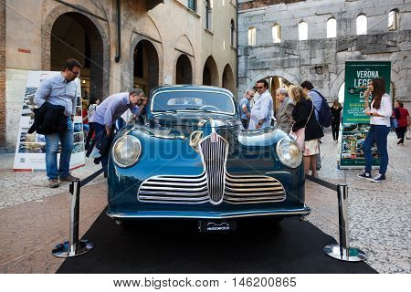 Verona Italy - May 07 2016: The retro car of Fiat nearby the Borsari gate on a pedestrian street