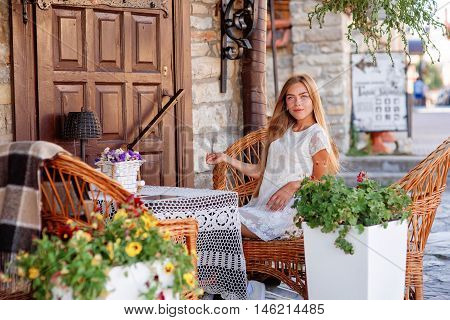 young woman in caffee looking aside. Fashion portrait