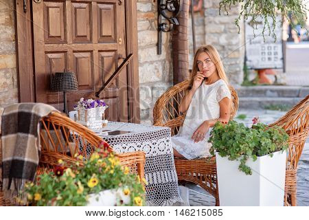 young woman in caffee looking aside. Fashion portrait
