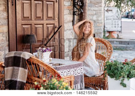 young woman in caffee looking aside. Fashion portrait