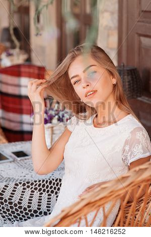 young woman in caffee looking aside. Fashion portrait