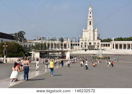 FATIMA, PORTUGAL - AUG 24: Sanctuary of Fatima in Portugal, as seen on Aug 24, 2016. It consists of a tall centralized bell-tower and nave, 213 ft in height, decorated by a 15,000 lb crown of bronze.