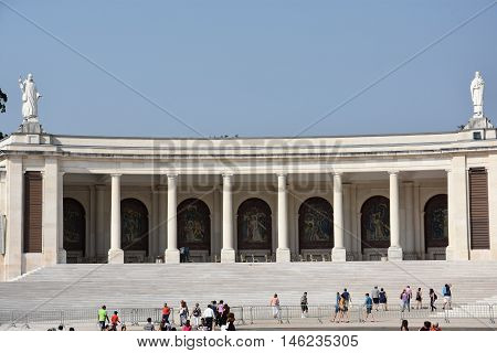 FATIMA, PORTUGAL - AUG 24: Sanctuary of Fatima in Portugal, as seen on Aug 24, 2016. It consists of a tall centralized bell-tower and nave, 213 ft in height, decorated by a 15,000 lb crown of bronze.