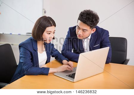 Young Boss And Assistant At Work