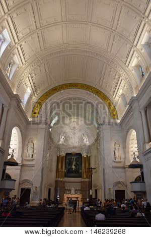 FATIMA, PORTUGAL - AUG 24: Sanctuary of Fatima in Portugal, as seen on Aug 24, 2016. It consists of a tall centralized bell-tower and nave, 213 ft in height, decorated by a 15,000 lb crown of bronze.