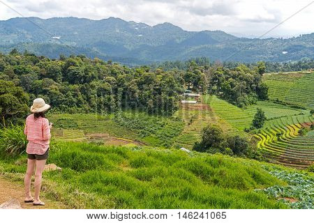 Back of the woman tourist at Mon Jam viewpoint at Chiang Mai Thailand.