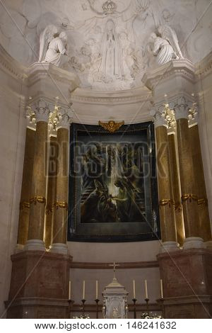 FATIMA, PORTUGAL - AUG 24: Sanctuary of Fatima in Portugal, as seen on Aug 24, 2016. It consists of a tall centralized bell-tower and nave, 213 ft in height, decorated by a 15,000 lb crown of bronze.
