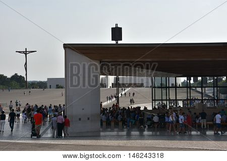 FATIMA, PORTUGAL - AUG 24: Sanctuary of Fatima in Portugal, as seen on Aug 24, 2016. It consists of a tall centralized bell-tower and nave, 213 ft in height, decorated by a 15,000 lb crown of bronze.