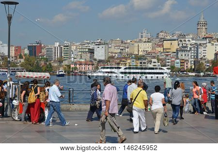 ISTANBUL TURKEY SEPTEMBER 29: People in Galata Karakoy quarter of Istanbul, Turkey and historic architecture and medieval Galata tower.On september 29 2013 in Istanbul Turkey