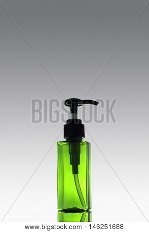 green color plastic soap bottle isolated onbackground