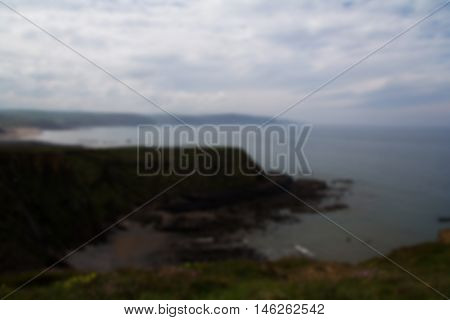 View Over The Coastline Near Widemouth Bay In Cornwall Out Of Focus.