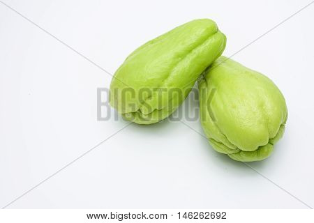 Sliced fresh Chayote and half isolated on white background.