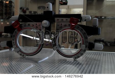 Optometric lenses and foropter device at the optics shop