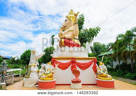 Ganesha Hindu God on the side with followers.