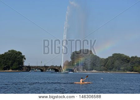 HAMBURG, GERMANY - AUG 26: Fountain at Alster Lake in Hamburg, Germany, as seen on Aug 26, 2016. In the city center, the Alster river forms two lakes, both prominent features in Hamburg's cityscape.