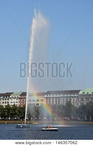 HAMBURG, GERMANY - AUG 26: Fountain at Alster Lake in Hamburg, Germany, as seen on Aug 26, 2016. In the city center, the Alster river forms two lakes, both prominent features in Hamburg's cityscape.