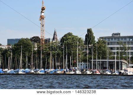 HAMBURG, GERMANY - AUG 26: Sailboats on Lake Alster in Hamburg, Germany, as seen on Aug 26, 2016. Hamburg was founded at the mouth of Alster river in the 9th century and has been used as a port since.