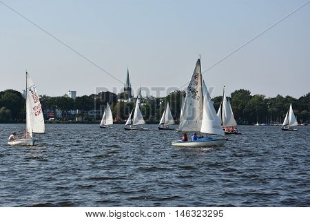 HAMBURG, GERMANY - AUG 26: Sailboats on Lake Alster in Hamburg, Germany, as seen on Aug 26, 2016. Hamburg was founded at the mouth of Alster river in the 9th century and has been used as a port since.