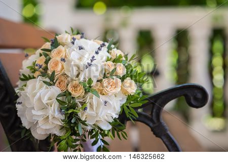 Beautiful Wedding Bouquet On A Wooden Bench