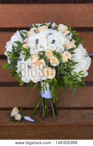 Beautiful Bridal Bouquet And Boutonniere On A Wooden Bench