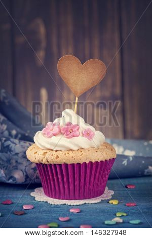 Cupcake with a heart cakepick