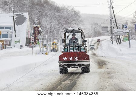 Hokkaido JAPAN - December 13 2011: Snow tractors running on road routes from Sapporo to Niseko in Hokkaido Japan