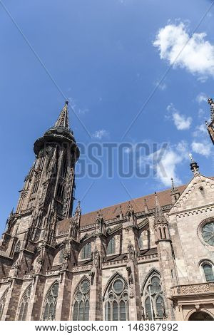 Main Tower Of World Famous Freiburg Muenster Cathedral, A Medieval Church In The City Of Freiburg