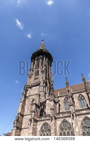 Main Tower Of World Famous Freiburg Muenster Cathedral, A Medieval Church In The City Of Freiburg