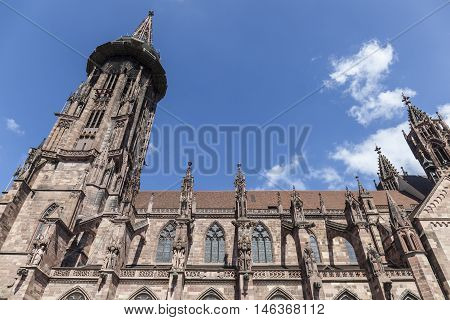 Main Tower Of World Famous Freiburg Muenster Cathedral, A Medieval Church In The City Of Freiburg