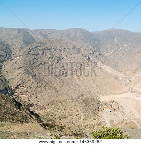 In Oman  The Old Mountain Gorge And Canyon The Deep Cloudy  Sky