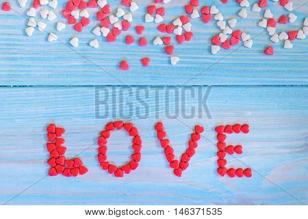 Red Candy Hearts Laying On Light Blue Painted Rustic Wooden Background