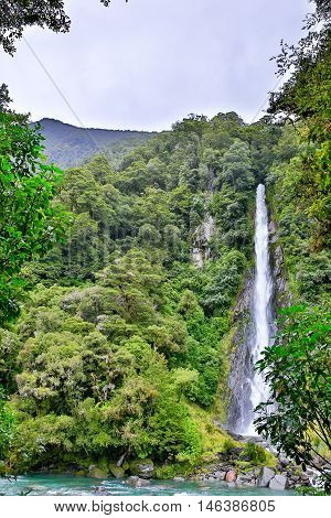 Waterfall In The Forest In Westland National Park, New Zealand