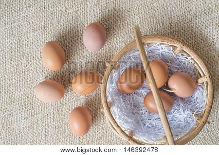Eggs In Bamboo Basket On Jute Sack