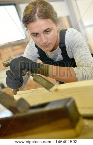 Young woman in crafstmanship school, training course
