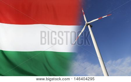 Concept clean energy with flag of Hungary merged with wind turbine in a blue sunny sky
